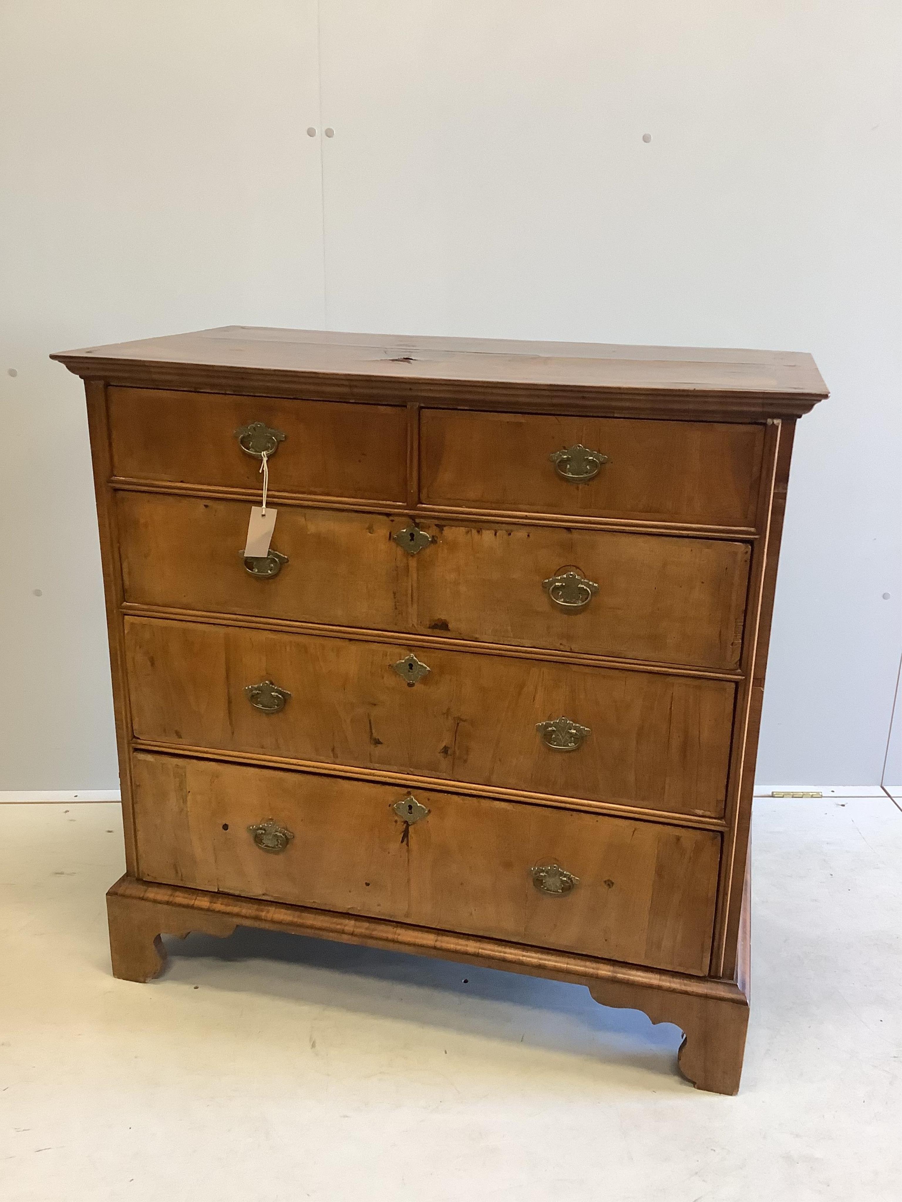 An 18th century and later banded walnut chest, width 101cm, depth 56cm, height 100cm. Condition - poor to fair